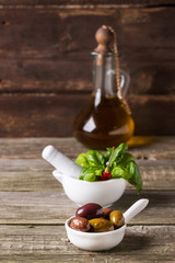 Olives with olive oil and basil