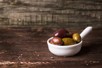 White bowl of olives