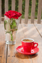 Beautiful table decorated with coffee and red rose