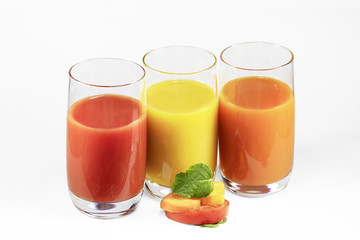 Glasses of tomato, pumpkin, carrot juice