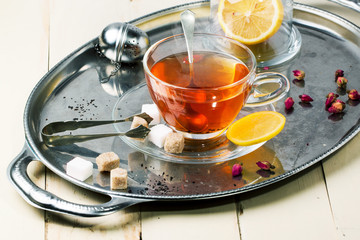 Cup of tea with sugar and lemon