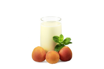 Cup of yogurt three apricot and mint leaves