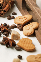 Cookies as hearts with coffee beans and spices
