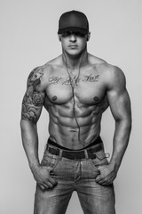 Black and white portrait of shirtless bodybuilder