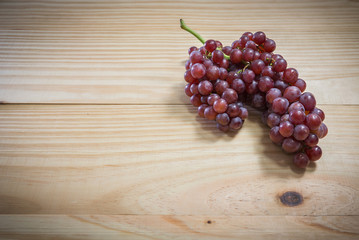 Grapes on wood background