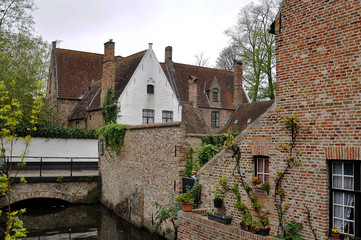 Fototapeta na wymiar The old traditional brick houses in Brugge - a small Belgian town