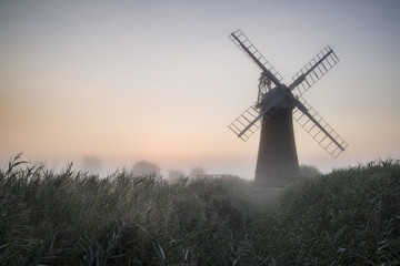 Plakat Windmill in stunning landscape on beautiful Summer dawn