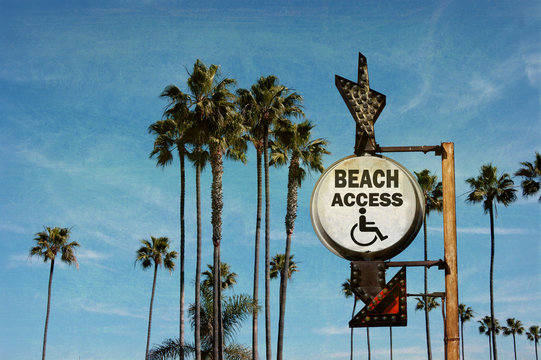 aged and worn vintage photo of beach access sign