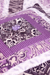 Patchwork cushion button.
Button on homemade purple patchwork cushion.
