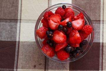Summer fruits in glass bowl
