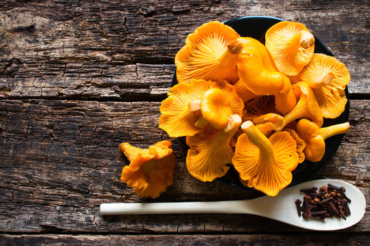 chanterelle mushrooms and spoon with condiments
