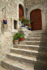 Fototapeta na wymiar idyllic doorsteps in italian village Santo Stefano di Sessanio i