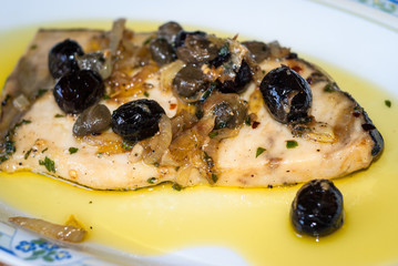 Delicious swordfish with sweet and sour onions and olives