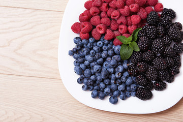 Juicy ripe natural organic raspberries blueberries blackberries