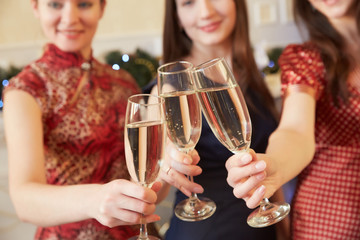 three glasses of champagne close-up women at a party