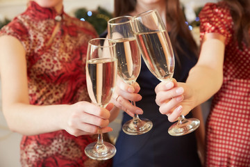 three glasses of champagne close-up women at a party