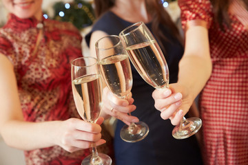 three glasses of champagne close-up women at a party