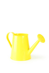 Yellow watering can isolated on white