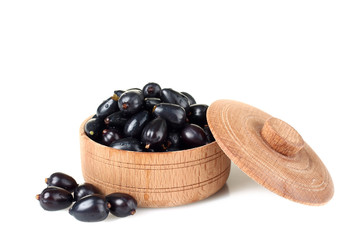 currants in a bowl on a white background