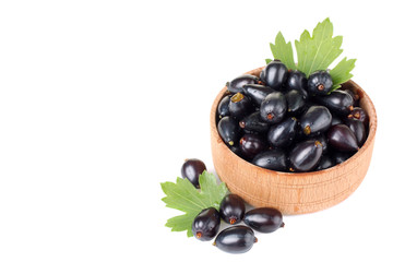 currants in a bowl on a white background