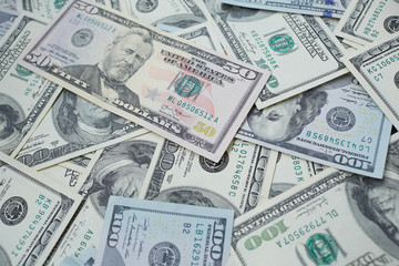  banknotes to 100 and 50 dollars  in a chaotic manner