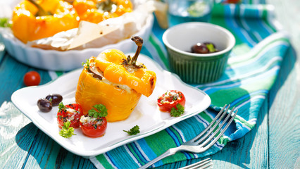 Roasted bell peppers stuffed with quinoa, mushrooms and cheddar cheese 