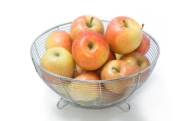 Organic apples in basket isolate on white
