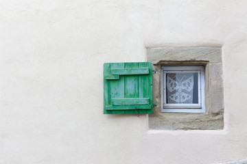 Small window and wooden shutter