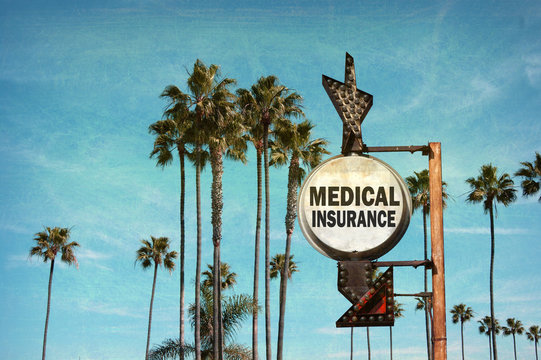 aged and worn vintage photo of medical insurance sign