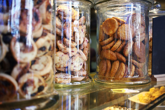Image of glass cookie jars in a coffee shop and bakery