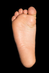 foot on a black background