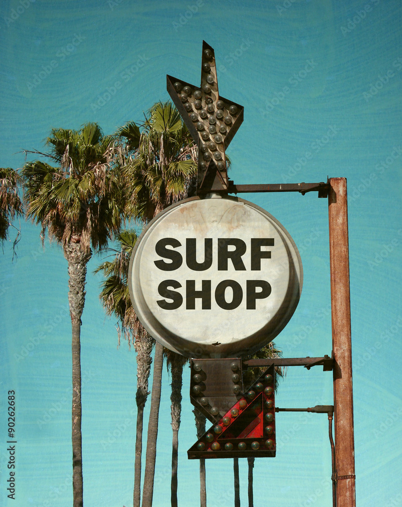 Wall mural aged and worn vintage photo of surf shop sign with palm trees