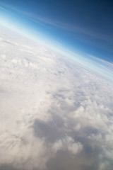 Fototapeta premium blue sky high view from airplane clouds shapes