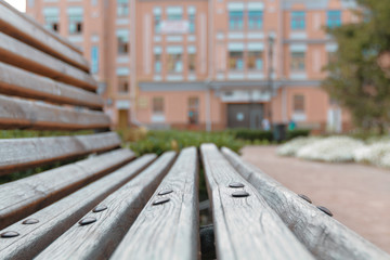 Fototapeta premium Wooden bench close-up, the old part of Kyiv