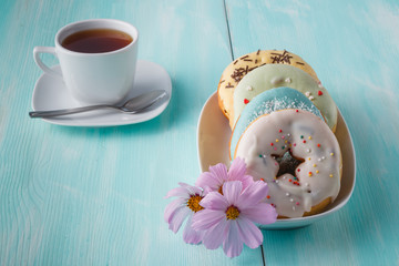 Four donuts on old wood table