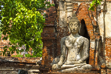 Ancient buddha in old wall