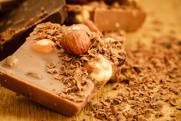 chocolate shavings and pieces on wooden table