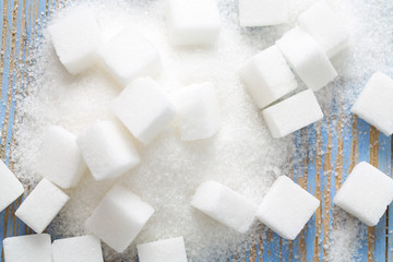 white sugar cubes on wooden surface