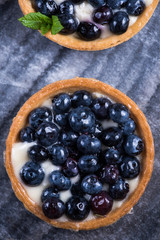 Homemade blueberry tart on marble board