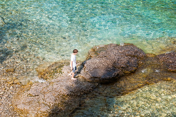 young boy swimming in the clear clean waters of the Bruce Peninsula National Park