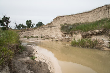 Highly eroded Sage Creek, runs through millions of years of geology in the Badlands of South Dakota.