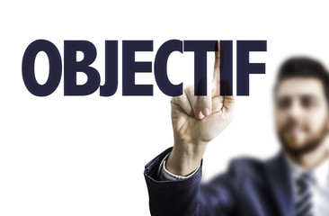 Business man pointing the text: Goal (in French)