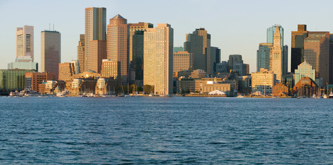 Obraz premium Panoramic of Boston Harbor and the Boston skyline at sunrise as seen from South Boston, Massachusetts, New England