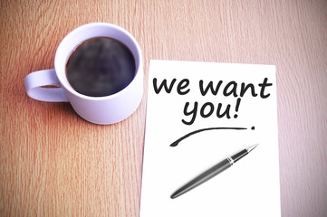 Coffee on the table with note writing we want you