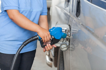 Fuel nozzle at a car service.