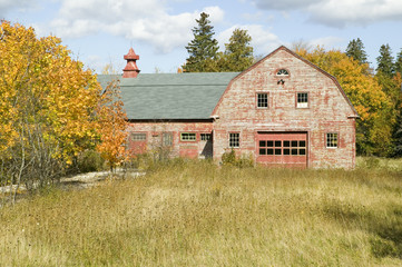 Distressed red barn in autumn, Acadia National Park, Maine