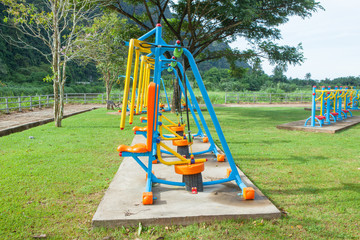 Fototapeta premium Exercise equipment in public park in the morning at Thailand