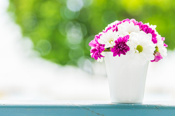 Boquet of flower in vase with outdoor view background