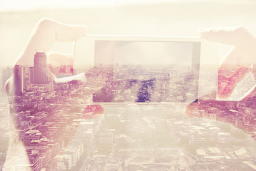 Double exposure of people with smart phone and cityscape background