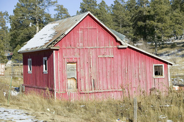 Fototapeta premium Red barn on Mescalero Apache Indian Reservation near Ruidoso and Alto, New Mexico